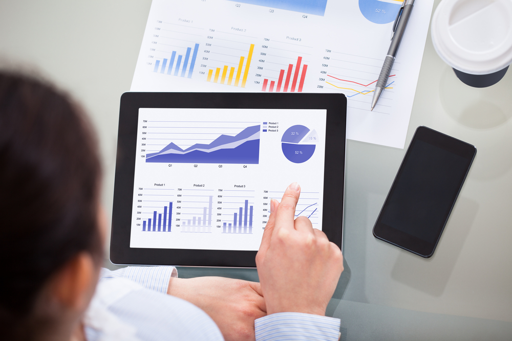 Close-up,Of,Businesswoman,With,Digital,Tablet,And,Document