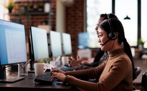 Paralyzed,Asian,Employee,Working,At,Call,Center,Reception,In,Disability