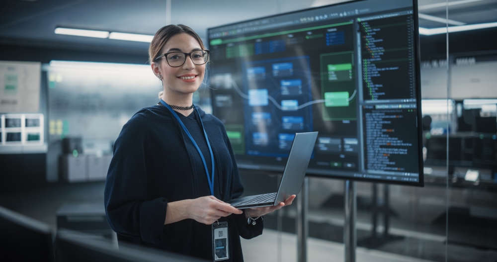 Portrait,Of,A,Beautiful,Diverse,Female,Wearing,Glasses,,Using,Laptop