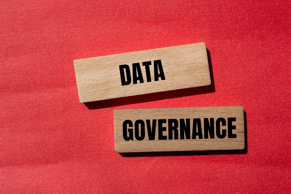 Data,Governance,Words,Written,On,Wooden,Blocks,With,Red,Background.